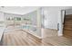 Spacious living room with hardwood floors and large windows overlooking the pool at 2409 Alpine Meadows Ave, Henderson, NV 89074