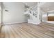 Open concept living room features hardwood floors and staircase leading to upper level at 2409 Alpine Meadows Ave, Henderson, NV 89074