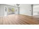 Bright living area with a ceiling fan and a sliding door to a balcony at 2409 Alpine Meadows Ave, Henderson, NV 89074