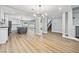 Inviting living space with hardwood floors that leads into the open kitchen and staircase at 2409 Alpine Meadows Ave, Henderson, NV 89074