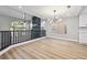 Bright open floorplan with hardwood floors, fireplace and a view to the kitchen at 2409 Alpine Meadows Ave, Henderson, NV 89074