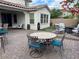Spacious backyard patio with comfortable seating and an outdoor dining area at 242 Homeward Way, Henderson, NV 89011