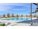 Community pool featuring a covered picnic area and lounge chairs with mountain views at 242 Homeward Way, Henderson, NV 89011