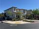 View of the home on a corner lot featuring a tile roof and low maintenance landscaping at 242 Homeward Way, Henderson, NV 89011