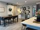Stylish kitchen and dining area with dark wood accents, light countertops, and a sliding barn door at 242 Homeward Way, Henderson, NV 89011
