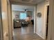 Open-concept living room featuring modern furniture and plank flooring at 242 Homeward Way, Henderson, NV 89011