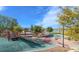 Community playground featuring multiple play areas and walking paths with lake views at 242 Homeward Way, Henderson, NV 89011