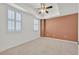 Spacious bedroom with plush carpet, tray ceilings, and ample natural light from the windows at 2455 W Serene Ave # 851, Las Vegas, NV 89123