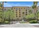 Multi-story building surrounded by lush greenery and palm trees at 2455 W Serene Ave # 851, Las Vegas, NV 89123