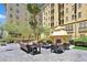 Outdoor patio with comfortable seating and outdoor fireplace for relaxing at 2455 W Serene Ave # 851, Las Vegas, NV 89123