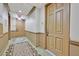 Condo hallway with patterned carpet and entry doors at 2455 W Serene Ave # 851, Las Vegas, NV 89123