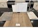 Kitchen finish selection featuring stainless faucet, white shaker cabinets, and wood laminate flooring at 2776 Via Napoli, Henderson, NV 89044