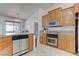 Spacious kitchen featuring stainless steel appliances, granite countertops, and tile flooring at 2780 Avenue Of The Stars, Pahrump, NV 89060