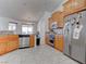 Bright kitchen with modern appliances, light wood cabinetry, and easy access to breakfast nook at 2780 Avenue Of The Stars, Pahrump, NV 89060