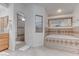 Relaxing main bathroom featuring a tiled walk-in shower and a large soaking tub with jacuzzi jets at 2780 Avenue Of The Stars, Pahrump, NV 89060