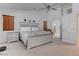 Expansive main bedroom featuring a ceiling fan, large bed, and a doorway to the main bathroom at 2780 Avenue Of The Stars, Pahrump, NV 89060