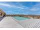 Sparkling pool with a deck and a desert mountain view beyond at 2780 Avenue Of The Stars, Pahrump, NV 89060