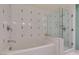 Bathroom featuring a glass-enclosed shower and separate soaking tub at 29 Montelago Blvd # 209, Henderson, NV 89011