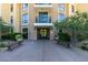 Building entrance featuring benches, landscaping, and doorway at 29 Montelago Blvd # 209, Henderson, NV 89011