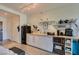 Kitchen with cabinets, appliances, and adjacent open shelving at 29 Montelago Blvd # 209, Henderson, NV 89011