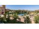 Picturesque view of the community lake with buildings and mountains in the background at 29 Montelago Blvd # 209, Henderson, NV 89011