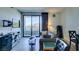 Living room with view of balcony, furniture, and TV at 29 Montelago Blvd # 209, Henderson, NV 89011