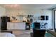 Living room and kitchen combo with furniture, TV, and decor at 29 Montelago Blvd # 209, Henderson, NV 89011