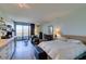Living room featuring wood floors, bed, furniture, and sliding glass door at 29 Montelago Blvd # 209, Henderson, NV 89011