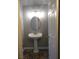 Simple bathroom with pedestal sink, decorative mirror and carpet at 3550 Bay Sands Dr # 2053, Laughlin, NV 89029