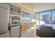 Sleek kitchen with stainless steel appliances and a stunning city view from a full wall of windows at 3722 Las Vegas Blvd # 603, Las Vegas, NV 89158