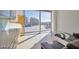 Bright living room with a contemporary sofa and city views from floor-to-ceiling windows at 3722 Las Vegas Blvd # 603, Las Vegas, NV 89158