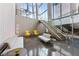 Modern building lobby with lounge seating and a staircase at 3722 Las Vegas Blvd # 603, Las Vegas, NV 89158