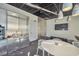 Stylish lounge area with kitchenette, modern seating, and a large screen TV for relaxation and entertainment at 3722 Las Vegas Blvd # 603, Las Vegas, NV 89158