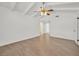 This spacious bedroom has an airy feel with a closet and light colored wood floors at 3935 Tirana Way, Las Vegas, NV 89103