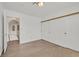 Bedroom with wood-look floors and sliding closet doors at 3935 Tirana Way, Las Vegas, NV 89103