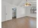 This spacious bedroom has an airy feel with a closet and light colored wood floors at 3935 Tirana Way, Las Vegas, NV 89103