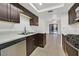 Well-lit kitchen features sleek appliances, countertops, and ample cabinet space at 3935 Tirana Way, Las Vegas, NV 89103