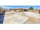 Spacious backyard with xeriscaping and a large covered patio, perfect for outdoor gatherings at 4011 Scott Russell Ct, North Las Vegas, NV 89031