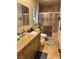 Bathroom with granite vanity, tiled floors, and a glass-enclosed shower at 4011 Scott Russell Ct, North Las Vegas, NV 89031