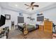 Relaxing bedroom design with a tray ceiling, a fan, and hardwood floors at 4011 Scott Russell Ct, North Las Vegas, NV 89031