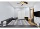 A cozy bedroom featuring a large bed with a plush headboard and soft lighting creating a relaxing ambiance at 4011 Scott Russell Ct, North Las Vegas, NV 89031