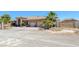 Picturesque home with block wall, metal gate and mature landscaping, circular driveway and desert landscaping at 4011 Scott Russell Ct, North Las Vegas, NV 89031