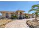 Inviting home boasting mature palms, desert landscaping, a circular driveway and 3 car garage at 4011 Scott Russell Ct, North Las Vegas, NV 89031