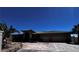 Beautiful home exterior with well-manicured landscaping, a three-car garage, and an inviting entrance at 4011 Scott Russell Ct, North Las Vegas, NV 89031