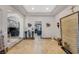 Expansive foyer with tile flooring leads to other rooms through elegant archways with tray ceilings at 4011 Scott Russell Ct, North Las Vegas, NV 89031