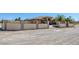 Attractive property features a walled gate with metal detailing, desert landscaping and privacy at 4011 Scott Russell Ct, North Las Vegas, NV 89031
