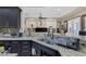 Close up view of granite countertops, sink, and faucet in modern kitchen at 4011 Scott Russell Ct, North Las Vegas, NV 89031