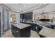 Open kitchen boasts a center island, granite countertops, and modern cabinetry at 4011 Scott Russell Ct, North Las Vegas, NV 89031