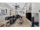 Spacious living room features leather furniture, a decorative fireplace, and an ornate entry at 4011 Scott Russell Ct, North Las Vegas, NV 89031