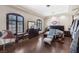 Bright main bedroom with dark hardwood floors, recessed lighting, and a large window at 4011 Scott Russell Ct, North Las Vegas, NV 89031